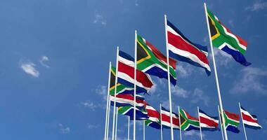 Costa Rica and South Africa Flags Waving Together in the Sky, Seamless Loop in Wind, Space on Left Side for Design or Information, 3D Rendering video