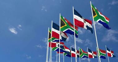 Dominican Republic and South Africa Flags Waving Together in the Sky, Seamless Loop in Wind, Space on Left Side for Design or Information, 3D Rendering video