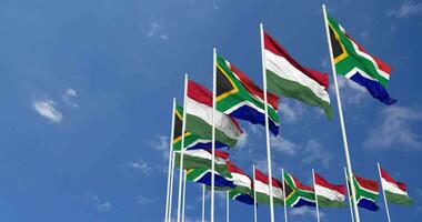 Hungary and South Africa Flags Waving Together in the Sky, Seamless Loop in Wind, Space on Left Side for Design or Information, 3D Rendering video