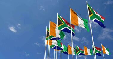 Ivory Coast and South Africa Flags Waving Together in the Sky, Seamless Loop in Wind, Space on Left Side for Design or Information, 3D Rendering video