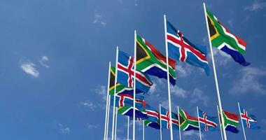 Iceland and South Africa Flags Waving Together in the Sky, Seamless Loop in Wind, Space on Left Side for Design or Information, 3D Rendering video