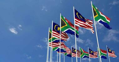 Malaysia and South Africa Flags Waving Together in the Sky, Seamless Loop in Wind, Space on Left Side for Design or Information, 3D Rendering video