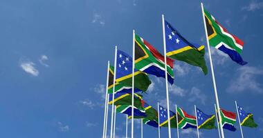 Solomon Islands and South Africa Flags Waving Together in the Sky, Seamless Loop in Wind, Space on Left Side for Design or Information, 3D Rendering video