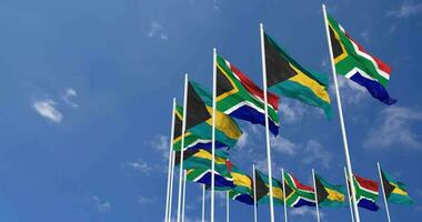 Bahamas and South Africa Flags Waving Together in the Sky, Seamless Loop in Wind, Space on Left Side for Design or Information, 3D Rendering video