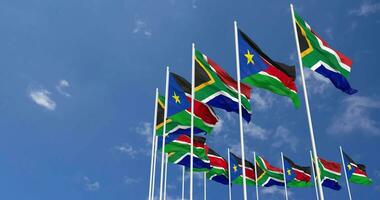 South Sudan and South Africa Flags Waving Together in the Sky, Seamless Loop in Wind, Space on Left Side for Design or Information, 3D Rendering video