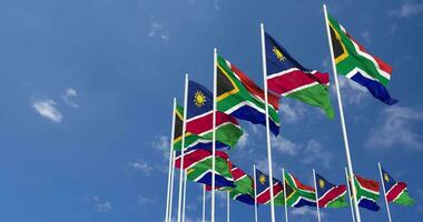 Namibia and South Africa Flags Waving Together in the Sky, Seamless Loop in Wind, Space on Left Side for Design or Information, 3D Rendering video