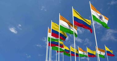 Colombia and India Flags Waving Together in the Sky, Seamless Loop in Wind, Space on Left Side for Design or Information, 3D Rendering video