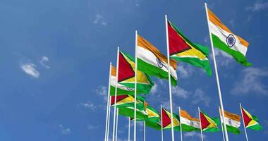 Guyana and India Flags Waving Together in the Sky, Seamless Loop in Wind, Space on Left Side for Design or Information, 3D Rendering video