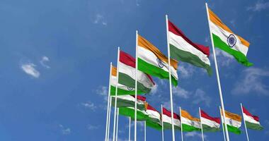 Hungary and India Flags Waving Together in the Sky, Seamless Loop in Wind, Space on Left Side for Design or Information, 3D Rendering video