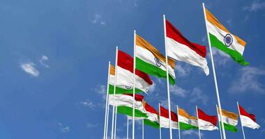 Indonesia and India Flags Waving Together in the Sky, Seamless Loop in Wind, Space on Left Side for Design or Information, 3D Rendering video