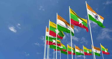 Mianmar, Birmânia e Índia bandeiras acenando juntos dentro a céu, desatado ciclo dentro vento, espaço em esquerda lado para Projeto ou Informação, 3d Renderização video