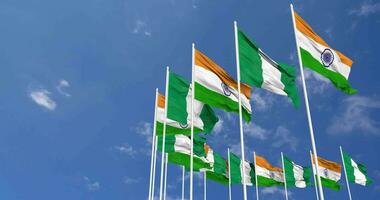 Nigeria and India Flags Waving Together in the Sky, Seamless Loop in Wind, Space on Left Side for Design or Information, 3D Rendering video