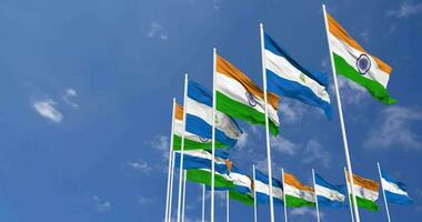 Nicaragua and India Flags Waving Together in the Sky, Seamless Loop in Wind, Space on Left Side for Design or Information, 3D Rendering video