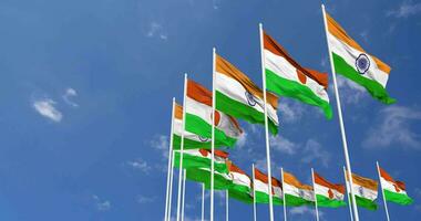 Niger and India Flags Waving Together in the Sky, Seamless Loop in Wind, Space on Left Side for Design or Information, 3D Rendering video