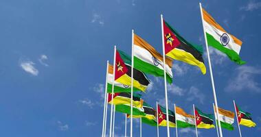 Mozambique and India Flags Waving Together in the Sky, Seamless Loop in Wind, Space on Left Side for Design or Information, 3D Rendering video