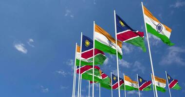 Namibia and India Flags Waving Together in the Sky, Seamless Loop in Wind, Space on Left Side for Design or Information, 3D Rendering video