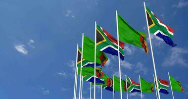 Zambia and South Africa Flags Waving Together in the Sky, Seamless Loop in Wind, Space on Left Side for Design or Information, 3D Rendering video