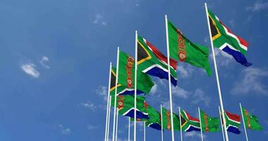turkmenistan en zuiden Afrika vlaggen golvend samen in de lucht, naadloos lus in wind, ruimte Aan links kant voor ontwerp of informatie, 3d renderen video