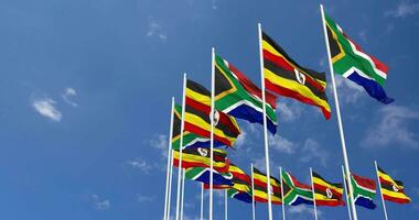 Uganda and South Africa Flags Waving Together in the Sky, Seamless Loop in Wind, Space on Left Side for Design or Information, 3D Rendering video