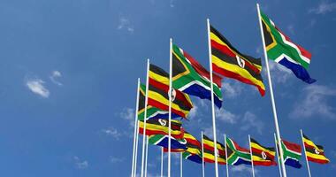 Uganda and South Africa Flags Waving Together in the Sky, Seamless Loop in Wind, Space on Left Side for Design or Information, 3D Rendering video