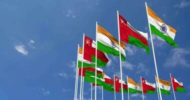 Oman and India Flags Waving Together in the Sky, Seamless Loop in Wind, Space on Left Side for Design or Information, 3D Rendering video