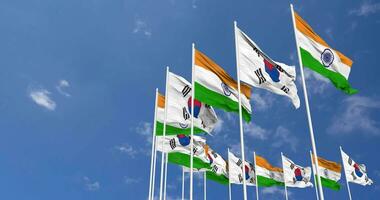 Süd Korea und Indien Flagge winken zusammen im das Himmel, nahtlos Schleife im Wind, Raum auf links Seite zum Design oder Information, 3d Rendern video