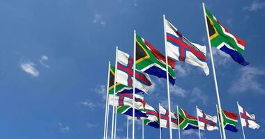 Faroe Islands and South Africa Flags Waving Together in the Sky, Seamless Loop in Wind, Space on Left Side for Design or Information, 3D Rendering video