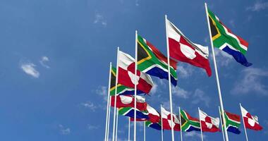 Greenland and South Africa Flags Waving Together in the Sky, Seamless Loop in Wind, Space on Left Side for Design or Information, 3D Rendering video