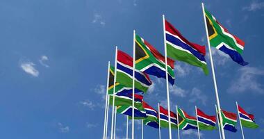 Gambia and South Africa Flags Waving Together in the Sky, Seamless Loop in Wind, Space on Left Side for Design or Information, 3D Rendering video