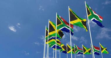 Jamaica and South Africa Flags Waving Together in the Sky, Seamless Loop in Wind, Space on Left Side for Design or Information, 3D Rendering video