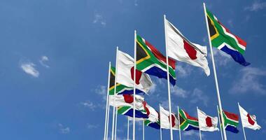 Japan and South Africa Flags Waving Together in the Sky, Seamless Loop in Wind, Space on Left Side for Design or Information, 3D Rendering video