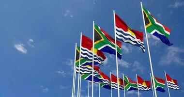 Kiribati and South Africa Flags Waving Together in the Sky, Seamless Loop in Wind, Space on Left Side for Design or Information, 3D Rendering video