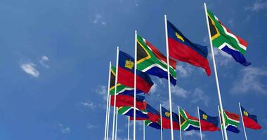 Liechtenstein and South Africa Flags Waving Together in the Sky, Seamless Loop in Wind, Space on Left Side for Design or Information, 3D Rendering video