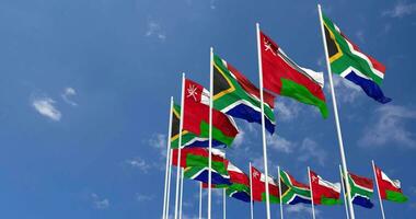 Oman and South Africa Flags Waving Together in the Sky, Seamless Loop in Wind, Space on Left Side for Design or Information, 3D Rendering video