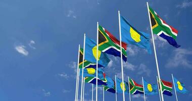 Palau and South Africa Flags Waving Together in the Sky, Seamless Loop in Wind, Space on Left Side for Design or Information, 3D Rendering video