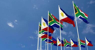 Philippinen und Süd Afrika Flaggen winken zusammen im das Himmel, nahtlos Schleife im Wind, Raum auf links Seite zum Design oder Information, 3d Rendern video