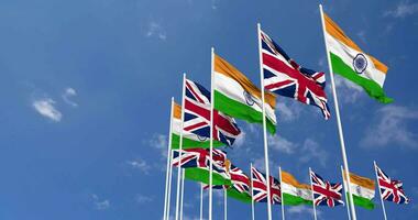 United Kingdom and India Flag Waving Together in the Sky, Seamless Loop in Wind, Space on Left Side for Design or Information, 3D Rendering video