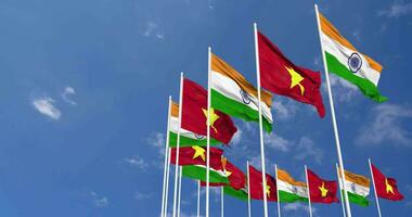 Vietnam y India bandera ondulación juntos en el cielo, sin costura lazo en viento, espacio en izquierda lado para diseño o información, 3d representación video
