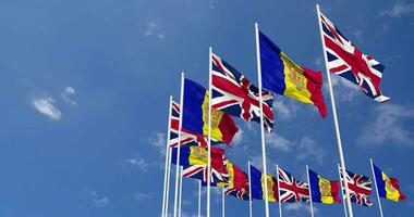 Andorra and United Kingdom Flags Waving Together in the Sky, Seamless Loop in Wind, Space on Left Side for Design or Information, 3D Rendering video