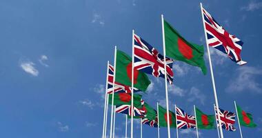 Bangladesh and United Kingdom Flags Waving Together in the Sky, Seamless Loop in Wind, Space on Left Side for Design or Information, 3D Rendering video