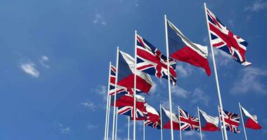 Czech Republic and United Kingdom Flags Waving Together in the Sky, Seamless Loop in Wind, Space on Left Side for Design or Information, 3D Rendering video