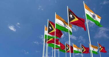 East Timor and India Flags Waving Together in the Sky, Seamless Loop in Wind, Space on Left Side for Design or Information, 3D Rendering video