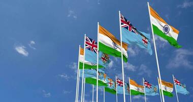 Fiji and India Flags Waving Together in the Sky, Seamless Loop in Wind, Space on Left Side for Design or Information, 3D Rendering video