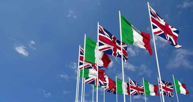 Italy and United Kingdom Flags Waving Together in the Sky, Seamless Loop in Wind, Space on Left Side for Design or Information, 3D Rendering video
