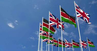 Kenya and United Kingdom Flags Waving Together in the Sky, Seamless Loop in Wind, Space on Left Side for Design or Information, 3D Rendering video