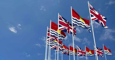 Kiribati and United Kingdom Flags Waving Together in the Sky, Seamless Loop in Wind, Space on Left Side for Design or Information, 3D Rendering video