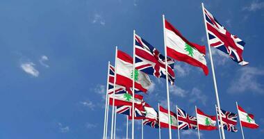 Lebanon and United Kingdom Flags Waving Together in the Sky, Seamless Loop in Wind, Space on Left Side for Design or Information, 3D Rendering video