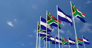 El Salvador and South Africa Flags Waving Together in the Sky, Seamless Loop in Wind, Space on Left Side for Design or Information, 3D Rendering video