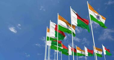 Madagascar and India Flags Waving Together in the Sky, Seamless Loop in Wind, Space on Left Side for Design or Information, 3D Rendering video