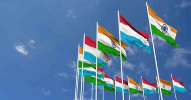 Luxembourg and India Flags Waving Together in the Sky, Seamless Loop in Wind, Space on Left Side for Design or Information, 3D Rendering video